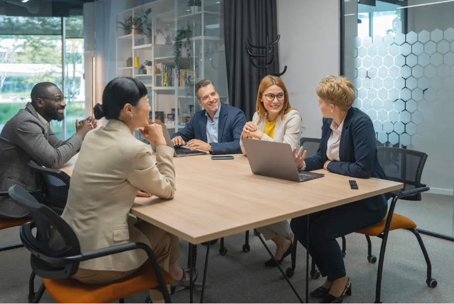 Business team meeting around conference table